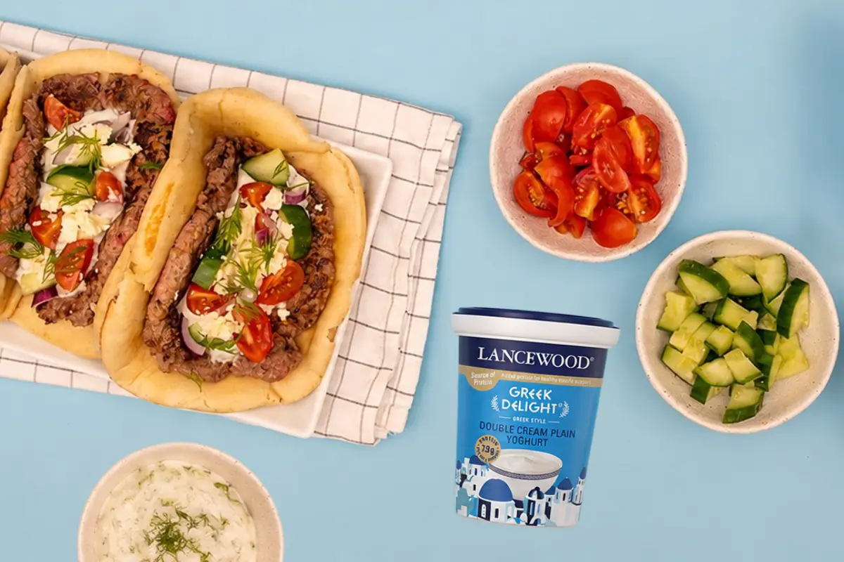 Smash Burger Pitas topped with homemade Greek yoghurt tzatziki made using LANCEWOOD® Greek Delight® Double Cream Plain Yoghurt