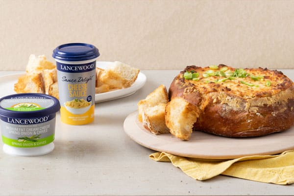 Decadent cheese dip in loaf crust