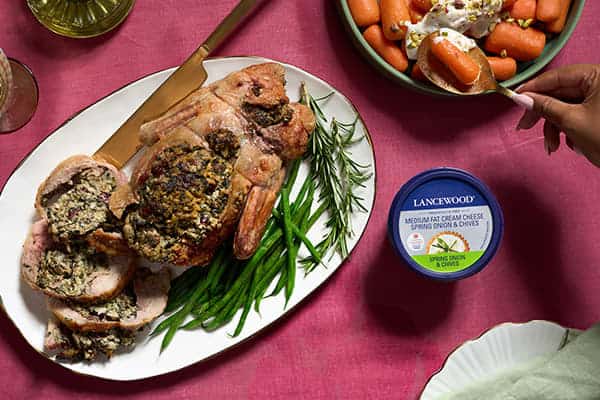 Delicious Recipes to Celebrate the Festive Season Together Festive deboned stuffed duck filled with spinach, walnuts, and cranberries, made with LANCEWOOD® Medium Fat Cream Cheese Spring Onion & Chives - an impressive cream cheese recipe for the holidays.