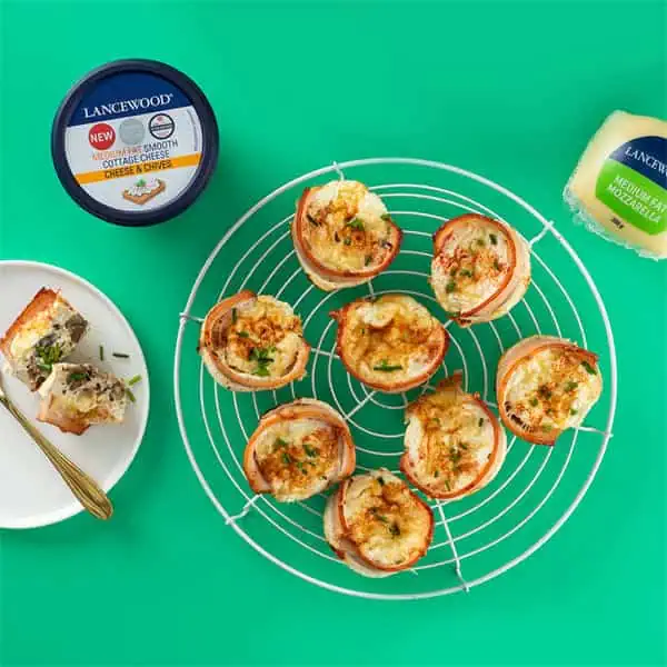 Top 10 Cottage Cheese Recipes: Delicious High-Protein Meals Banting breakfast bacon and egg cups with LANCEWOOD® cottage cheese, served on a plate and cooling rack