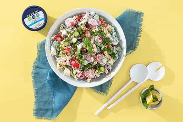 Celebrate World Pasta Day with these 10 irresistible recipes Creamy Greek pasta salad with olives, tomatoes and cottage cheese, ideal pasta salads for braai gatherings