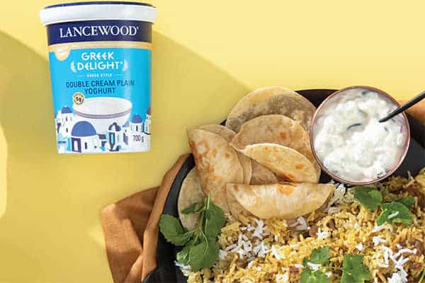 The Ultimate Heritage Day Food Guide: Easy breyani recipe with spiced lamb, rice and fresh coriander served with yoghurt and flatbreads