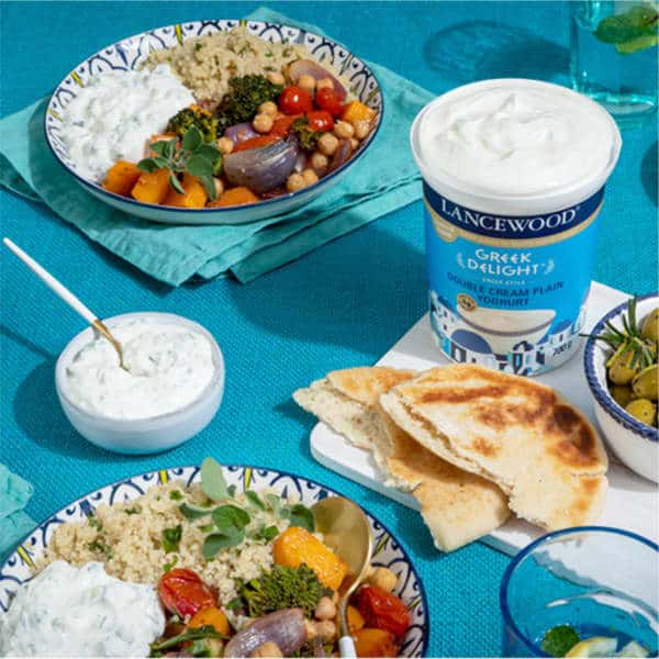 Creamy, Dreamy & Dairy: Discover Our Yoghurt Range Lancewood® Greek Yoghurt tzatziki dip served with pita and veggies - the best tzatziki recipe in South Africa.