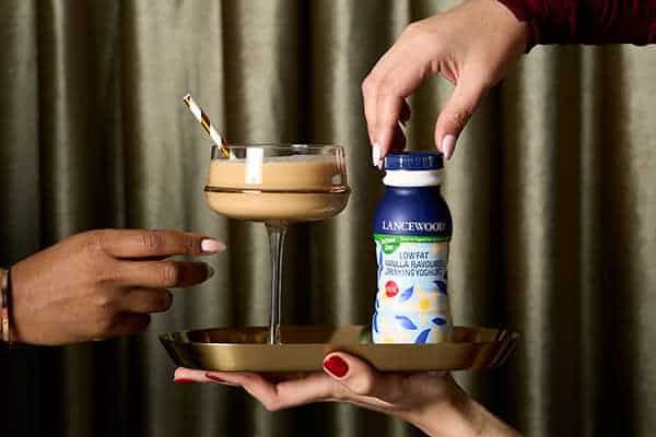 Delicious Recipes to Celebrate the Festive Season Together Vanilla-Amaretto Cream Fizz cocktail made with LANCEWOOD® Low-Fat Vanilla Flavoured Drinking Yoghurt - a smooth, creamy festive drink with a hint of coffee liqueur.