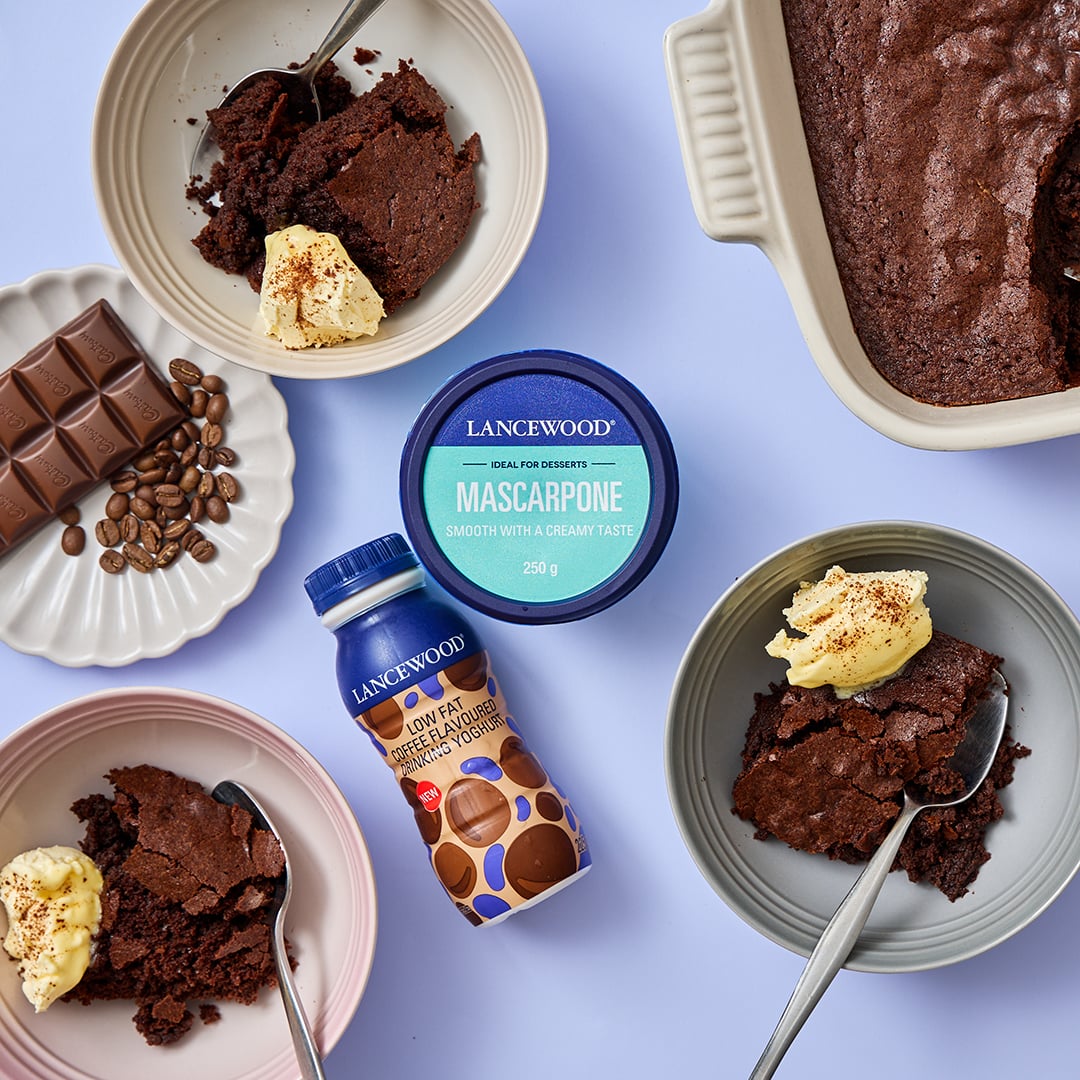 Warm chocolate and coffee brownie pudding served with Lancewood mascarpone cheese in a rustic pudding bowl