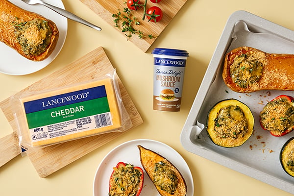 Cheesy roasted vegetables filled with creamy spinach and mushroom sauce served as a comforting braai side dish
