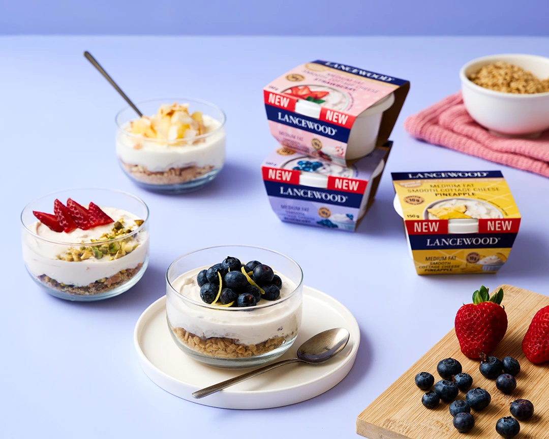 Easy dessert bowls layered with biscuits, granola, fruity cottage cheese and fresh fruit