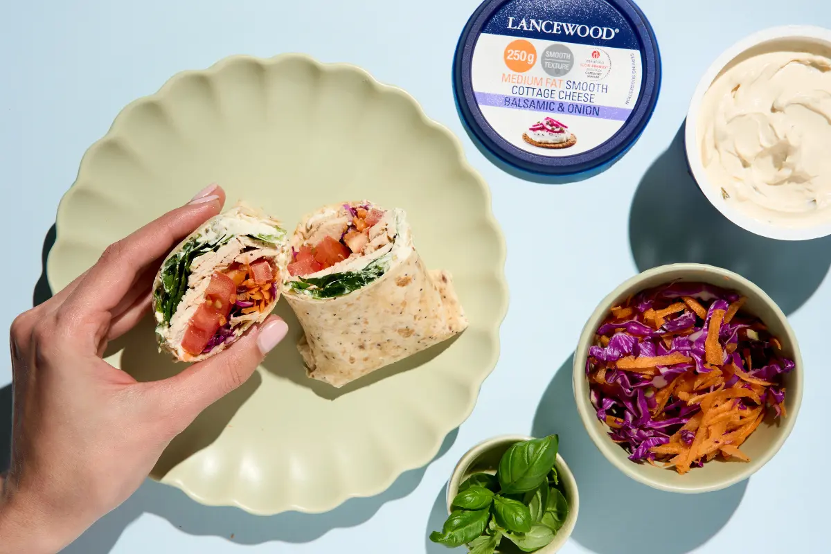Crispy cottage cheese wrap cut in half, served on a plate with LANCEWOOD® cottage cheese