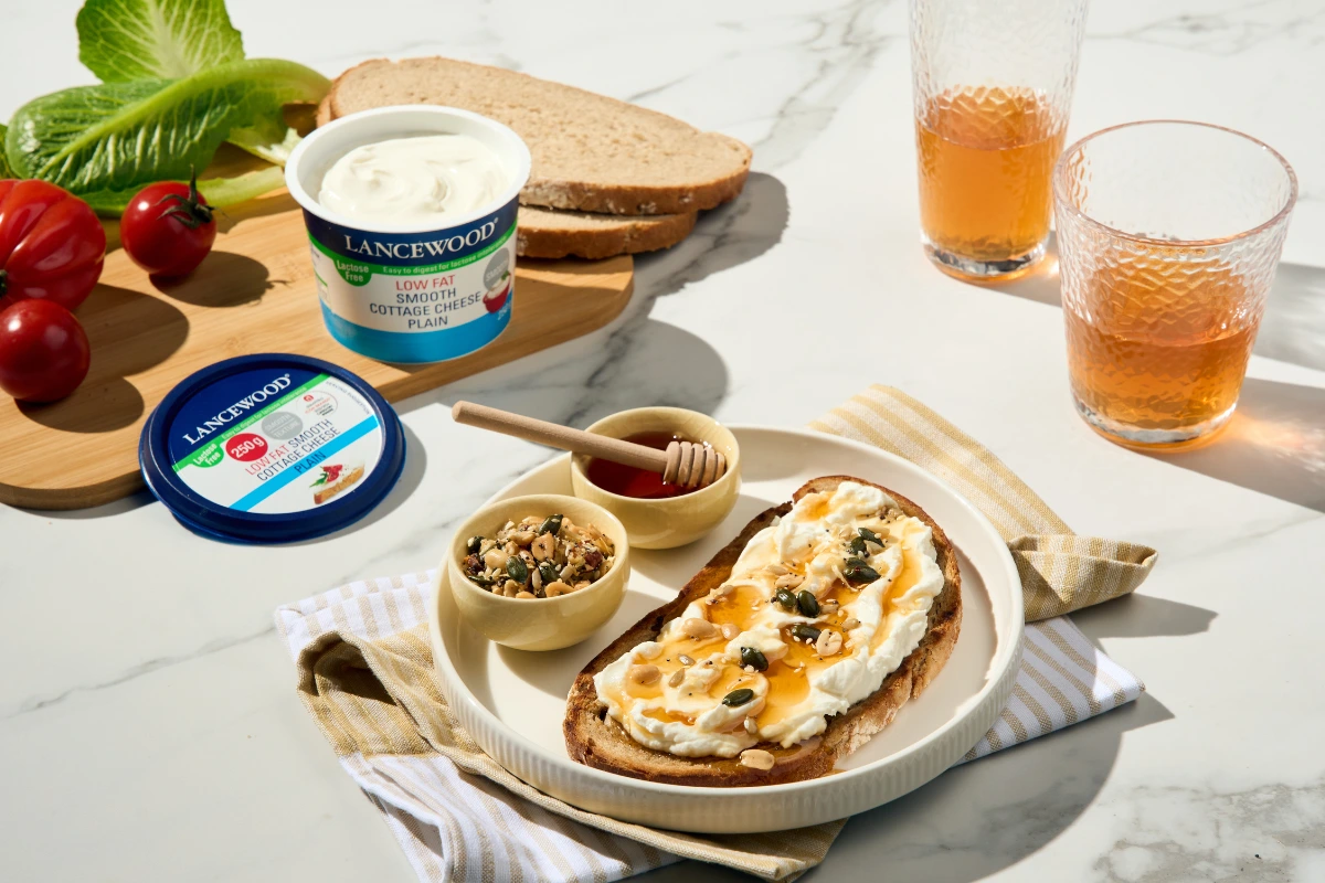 Cottage cheese high-protein toast with hot honey and seeds and herbs