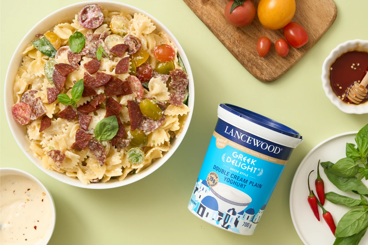 Hot honey chorizo pasta salad with colourful tomatoes and fresh basil