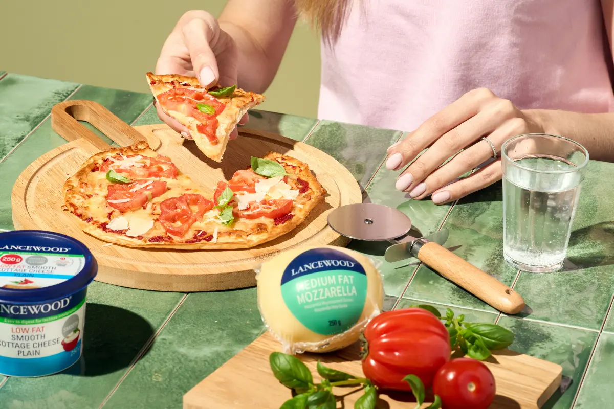 Viral Hailey Bieber pizza enjoyed at a table with LANCEWOOD® Cottage Cheese