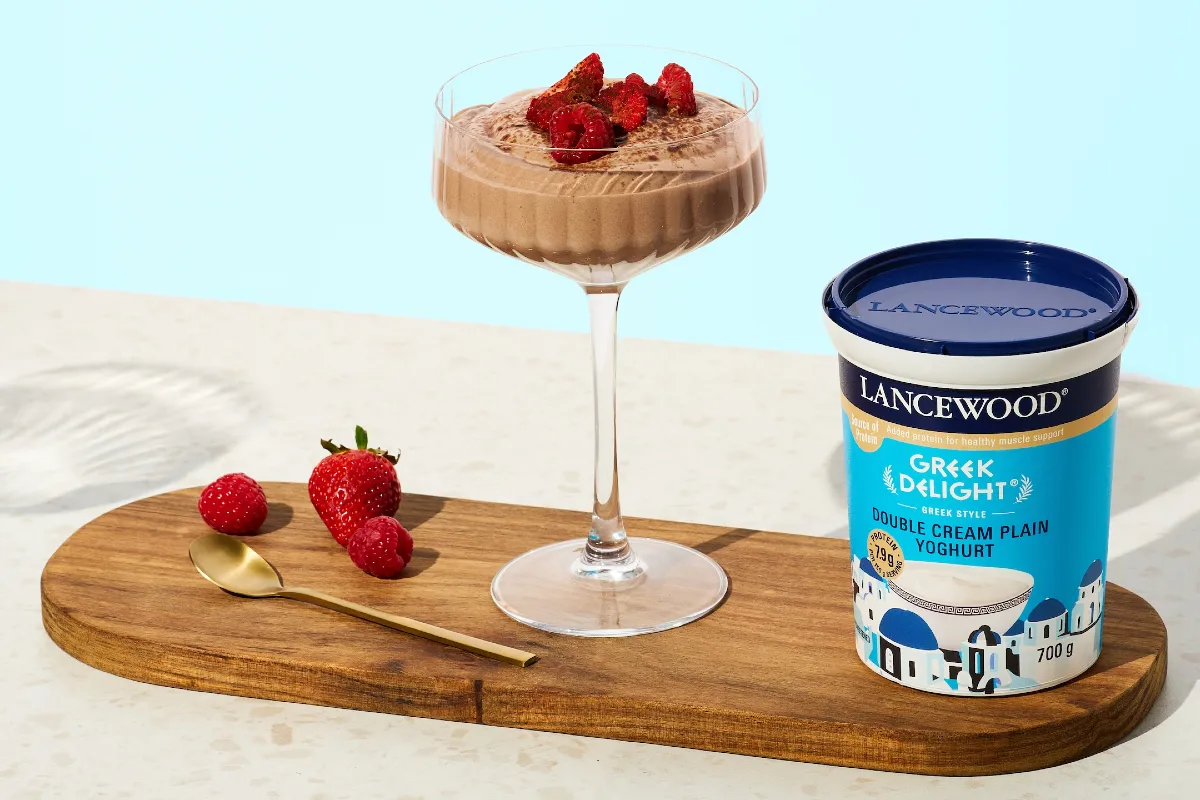 High protein chocolate mousse topped with rasberries and served in a glass, with LANCEWOOD Greek Delight® yoghurt